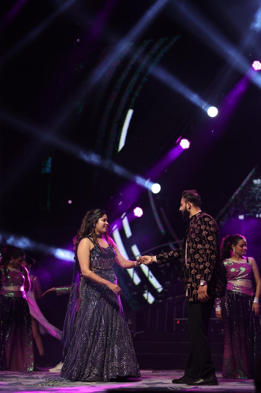 Ankit and Prisha dancing on stage