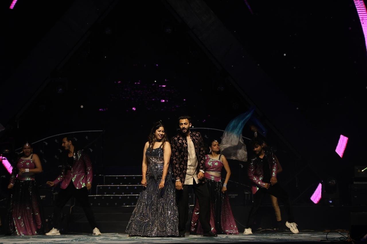 Ankit and Prisha performing with dancers